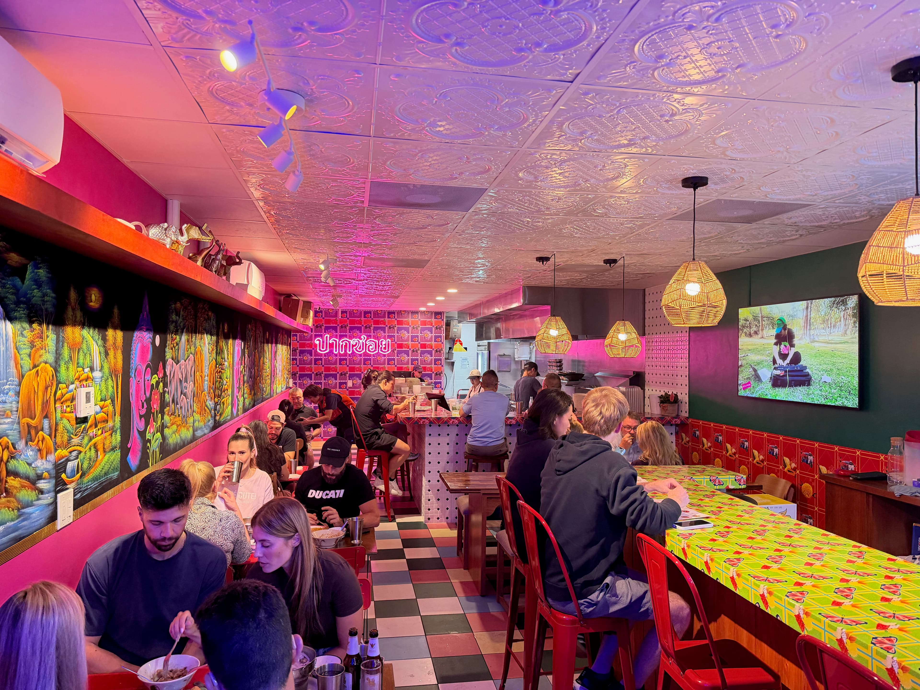 SOI interior with pink walls and neon
