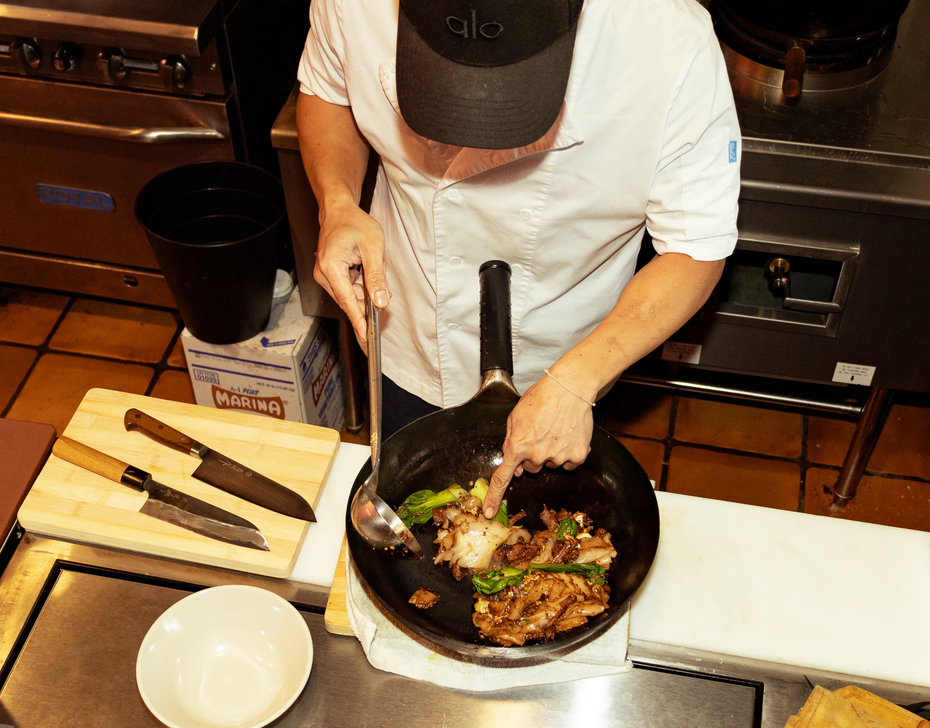 Chef Ono holding knife in kitchen